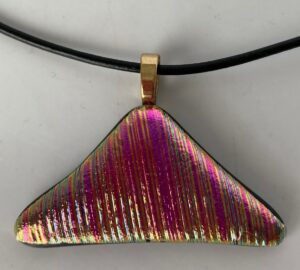 Dramatic textured dichroic pendant with yellows and pinks. Item number N65: 2" x 1" inches. Price: $20