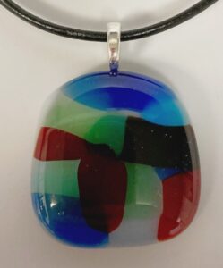 Playful mix of colors make up this casual pendant. Item number N92: 1" x 1" inches. Price: $10