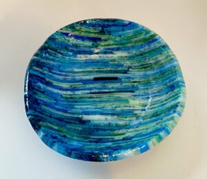 Visions of the oceans make up this decorative on-edge bowl. Number 220. 8 1/2" by 1 1/2" deep". Price: $45
