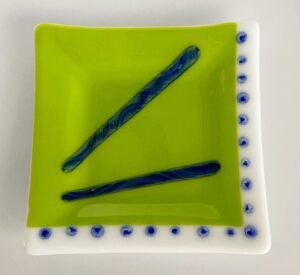 Striking green plate with swirl blue accents. Item number 225: 6 3/4" by 6 3/4". Price: $35