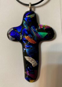 Traditional shaped dichroic cross pendant with beautiful red, blue, green, pink, silver & gold pieces. Item number N97: 2 3/4" by 1 3/4" x 1 1/4" inches. Price: $40