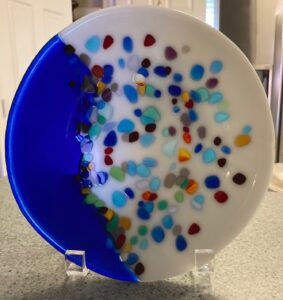 Beautiful white and transparent blue bowl display piece with blues, greens, purples, yellows, reds and oranges. Item number 230: 8" bowl. Cost: $35.00