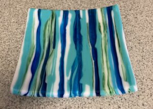 An experiment with movement using different thicknesses of glass. And the one bubble towards the middle finishes the effect of of ocean waves. Item number 235: 8" by 8" that is 1/2" THICK. Price: $65